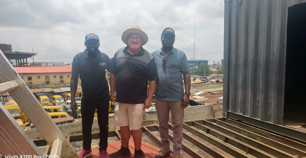 CFS Ikeja production yard — steel, containers, and crew
